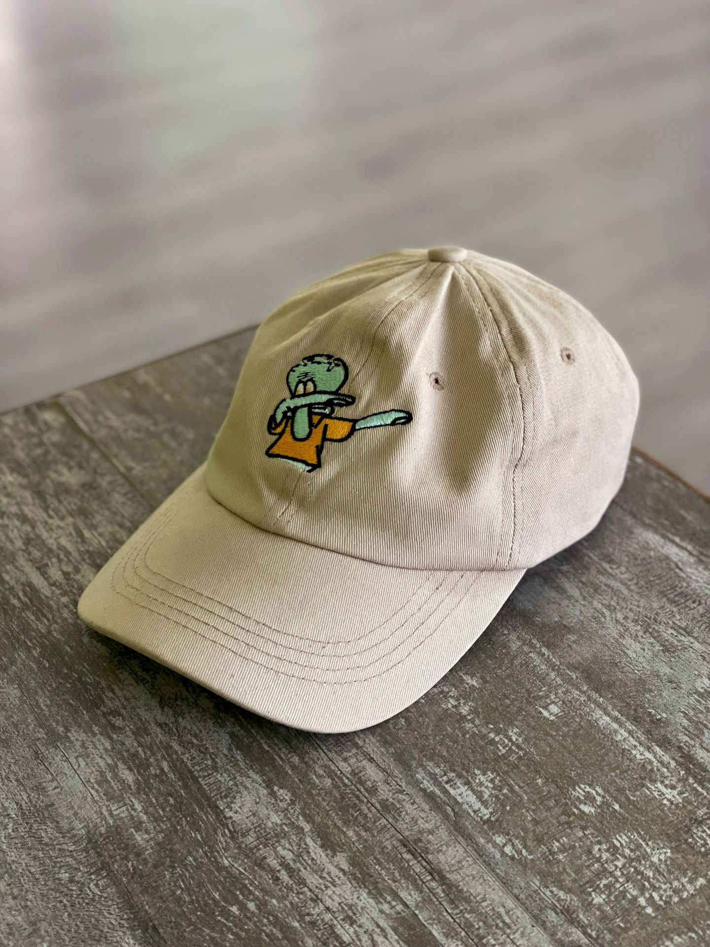 a baseball cap with a cartoon character on it
